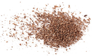 Pile chopped, milled chocolate with hazelnut isolated on white background, top view