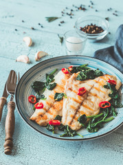 Grilled sea bream fish fillet with spinach
