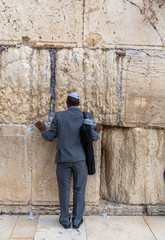 Israel, Jerusalem - 31 December 2018: Men praying at the Western Wall