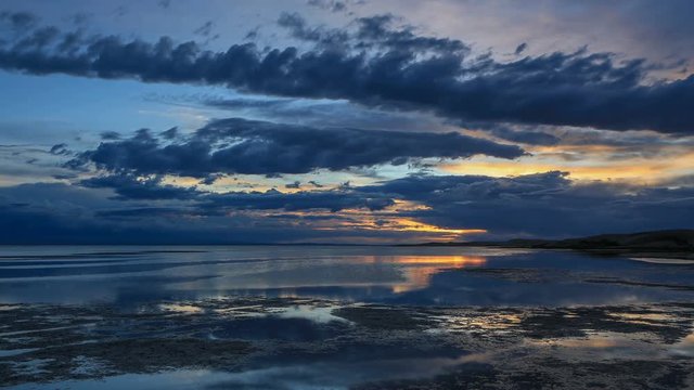 4K. Sunset on the salted lake Durgun Nuur, Mongolia. Ultra HD, 4096x2304