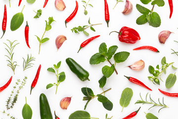 Spice herbal leaves and chili pepper on white background. Vegetables pattern. Floral and vegetables on white background. Top view, flat lay.