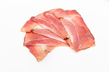 Hamon sliced on white background. Spanisch traditional meat.