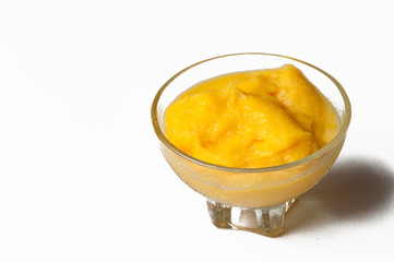 Grinded orange in bowl isolated on a white background.Fruit