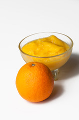 Grinded orange in bowl isolated on a white background.Fruit