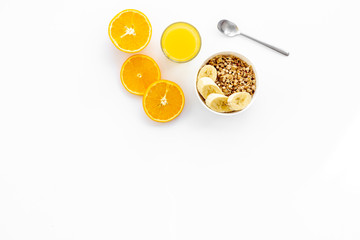 food for healthy breakfast with granola and fresh orange juice on bright white background top view mock up