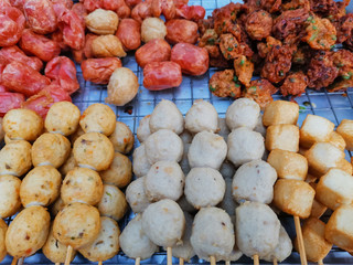grilled Meat balls and sausages on stick, Street food in Thailand.