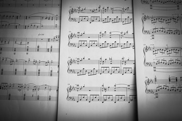 Naklejka premium music notes and sheets background