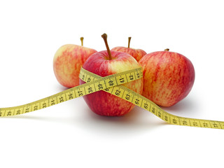 Group of red and yellow apple with yellow weight tape scale isolated on white background, dieting of human concept.