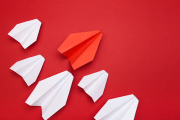 winner red  paper aircraft on red background