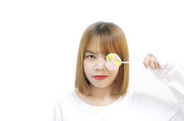 easterner girl eating colourful lollipop.