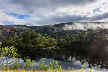 Fototapeta na wymiar Scenic lake and natural landscape along a road in Hordaland county near Bergen, Norway