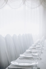 white chairs in the banquet room