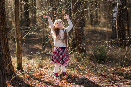  little girl in nature have fun and dance