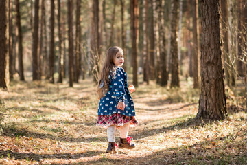  little girl in nature have fun and dance
