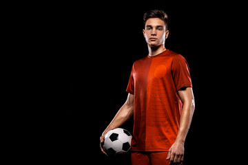 Teenager - soccer player. Boy in football sportswear after game with ball. Sport concept.