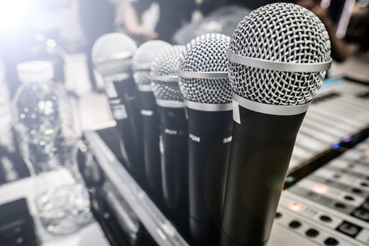Many Microphone standby on Sound Mixer Board with colorful Jack in out to adjust detail of volume high low bar MC DJ on stage and profession to speak presentation, soundboard equipment selective focus