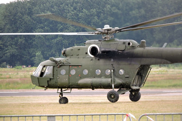 A military helicopter takes off at the airport © E-lona