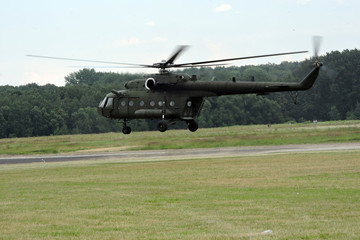 A military helicopter takes off at the airport © E-lona