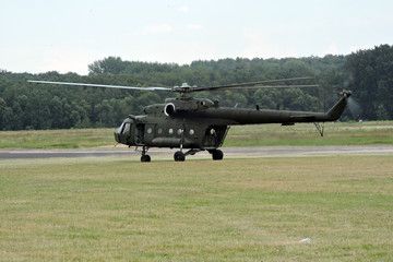 A military helicopter takes off at the airport © E-lona