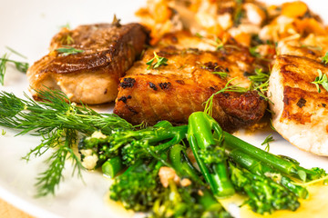 Roasted carp fish with broccoli and dill.