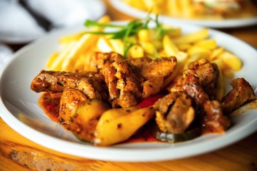 Fried chicken pieces with vegetable.