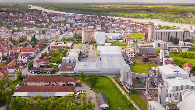 Elevation hyperlapse in Brcko district in Bosnia and Herzegovinia at industrial zone. Very busy day with lots of wind and partly sunny day. Mavic 2 Pro 4k d-log.