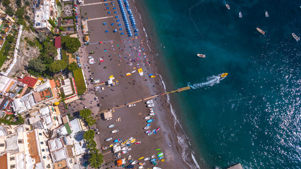 top down aerial view of the touristic city, the mountains and the beach, hotels and restaurants, buildings, business tours, sea holidays, luxury apartments Positano, Amalfi, Italy