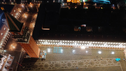 Aerial drone night shot of iconic illuminated Saint Mark's square or Piazza San Marco featuring...