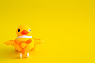 Yellow plane isolated on a yellow background.