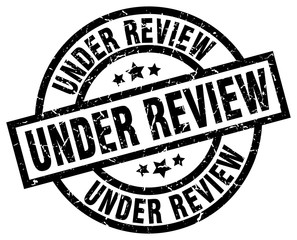 under review round grunge black stamp