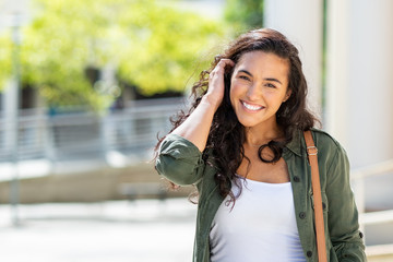 Happy young woman on street