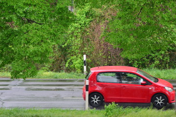 Fast moving blurred car in germany on a rainy day in april