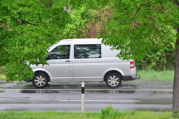 Fast moving blurred car in germany on a rainy day in april