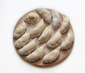 dumplings dumplings on a wooden circle.