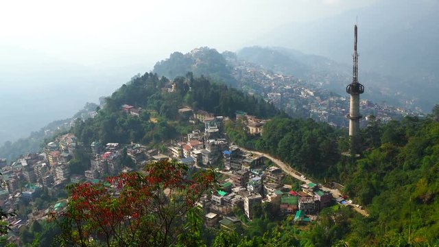 Gangtok city is on mountain range from high view morning time, Zoom out.