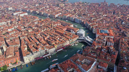 Fototapeta na wymiar Aerial drone photo of iconic and unique Ponte Rialto or Rialto bridge crossing Grand Canal, Venice, Italy