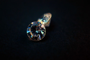Diamond gem on black background