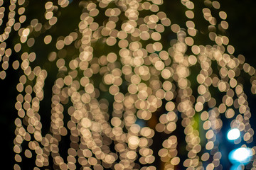 light night city bokeh abstract background glittering stars on bokeh. Orange bokeh in the bottom of the picture. Has a black background- Image