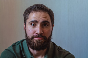 Various emotions on a face at the young bearded European man. Different mood.