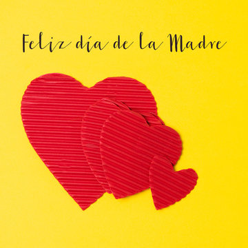 hearts and text happy mothers day in spanish