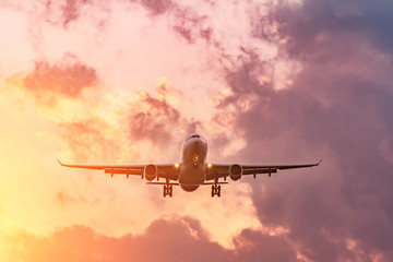 Evening flight, completion of the flight of the aircraft, landing at the airport at sunset and beautiful sky.