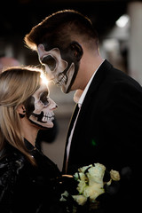 Halloween couple. Dressed in wedding clothes romantic zombie