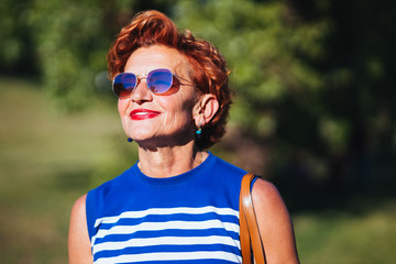 Portrait of a mature woman walking in the park