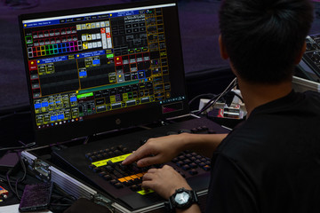 Sound engineer working at his mixing console