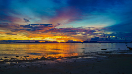 Fototapeta na wymiar Summer panoramic pink and yellow sunset over the sea, holidays in Thailand concept