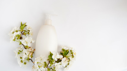 Obraz na płótnie Canvas Top view bathroom supplies and spa cosmetic spray bottle and white flowers isolated on white background . copy space