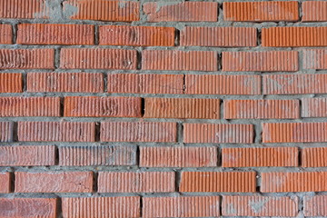 The texture of the walls of the construction of porous brick