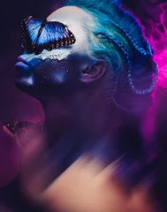 Poster Im Rahmen Beautiful woman with blue hair and butterfly © Nejron Photo
