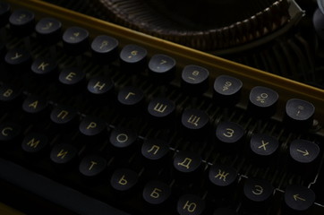 An Old manual typewriter with its working keyes with numbers and letters