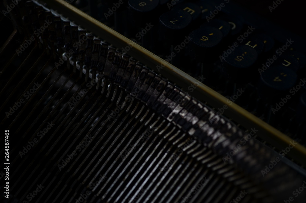 Poster an old manual typewriter with its working keyes with numbers and letters